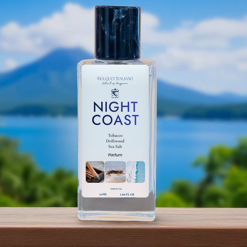 NIGHT COAST Luxury Travel Perfume 50 mL bottle on a ledge, lake and mountain behind